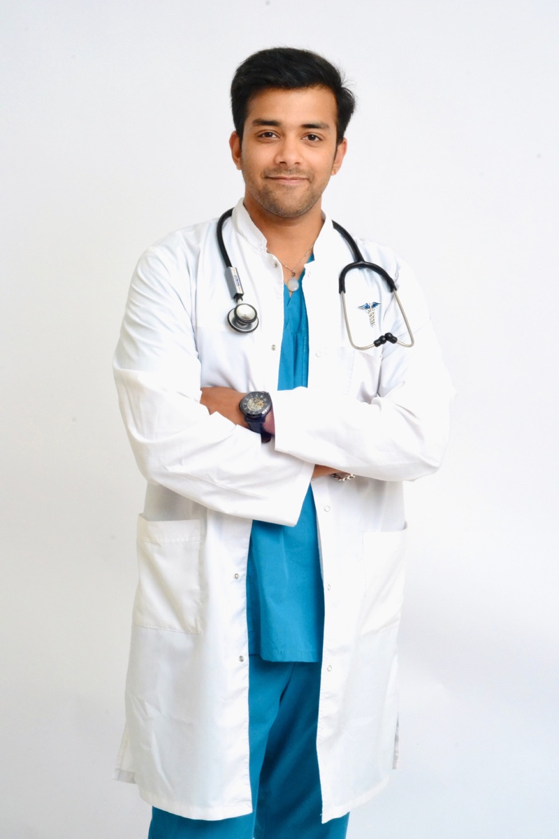 Dr. Shivang Gupta — clinical portrait in lab coat with stethoscope