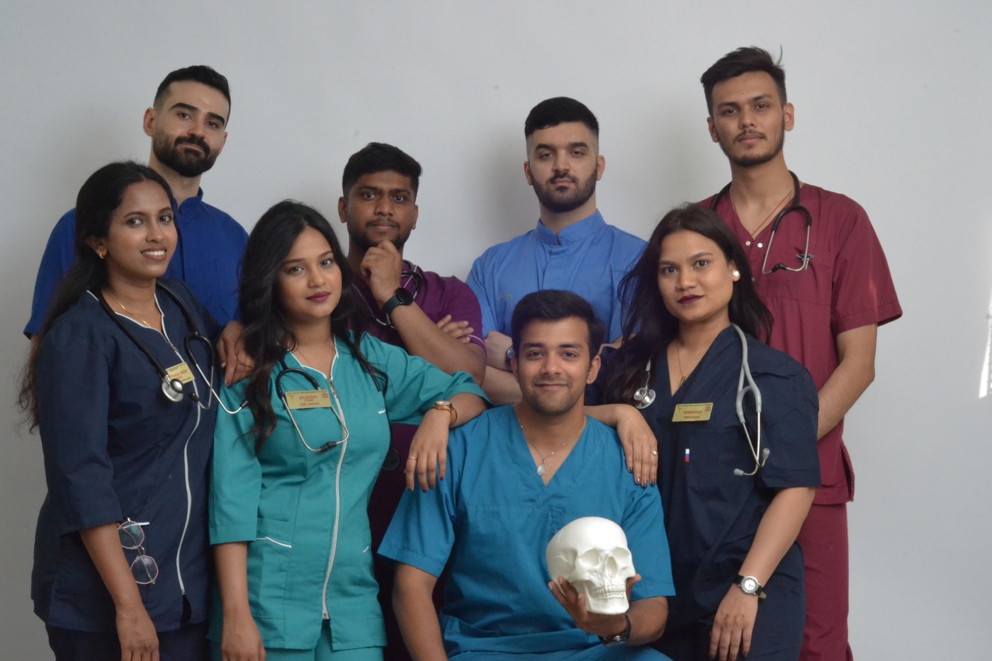 Medical student team in scrubs and lab coats